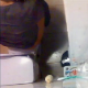 A ceiling mounted hidden camera records an unsuspecting plump woman taking a shit in a restroom. Shitting and pissing sounds are audible and finished product is visible when she stands up after wiping. About 3 minutes.